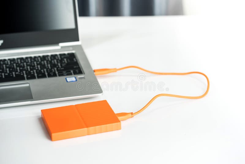 Close up of external hard disk drive for connect to laptop, transfer or backup data between computer and HDD