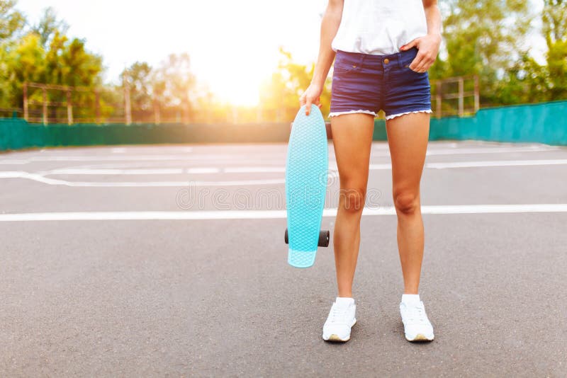 Close-up of Feet, Girl with Skate in Skate Park, at Sunset Stock Photo ...