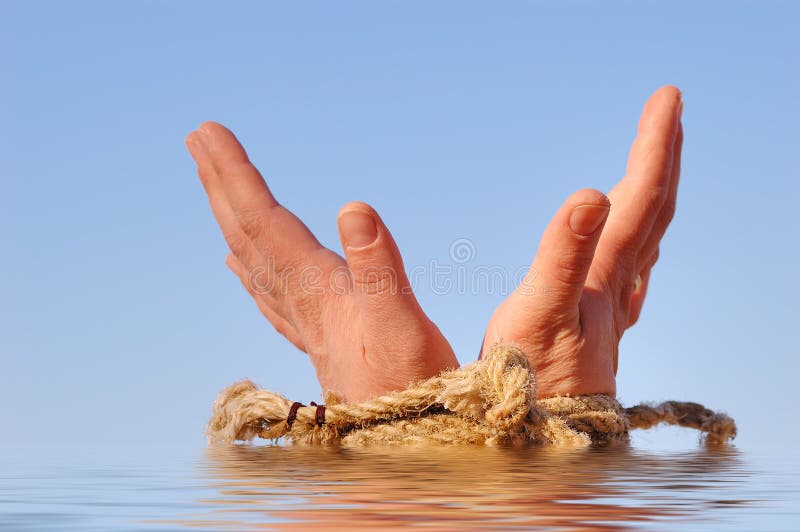 Close up of female hands tied in a rope