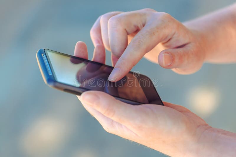 Close up of female hands using smartphone device royalty free stock image Close up of female hands using smartphone device royalty free stock image