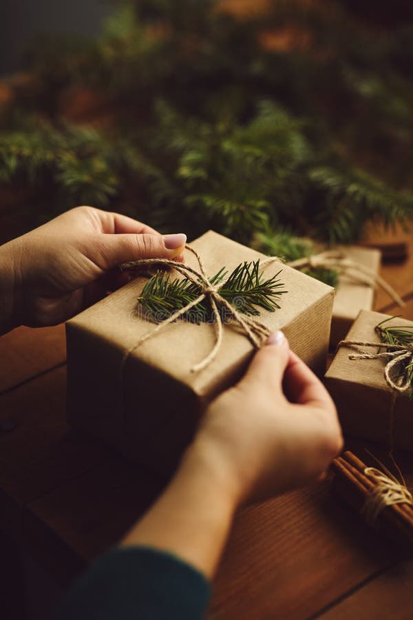 Close-up of female hands while wrapping Christmas present royalty free stock photography Close-up of female hands while wrapping Christmas present royalty free stock photography