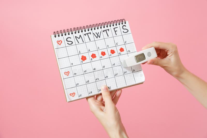 Close up female holds in hand thermometer, female periods calendar for checking menstruation days isolated on trending stock photos Close up female holds in hand thermometer, female periods calendar for checking menstruation days isolated on trending stock photos