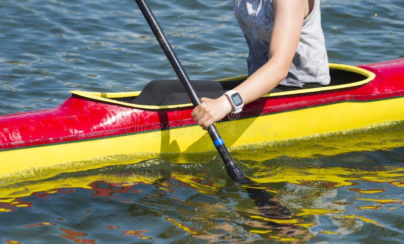 Close-up of female kayaker paddling through water rapids royalty free stock photos Close-up of female kayaker paddling through water rapids royalty free stock photos