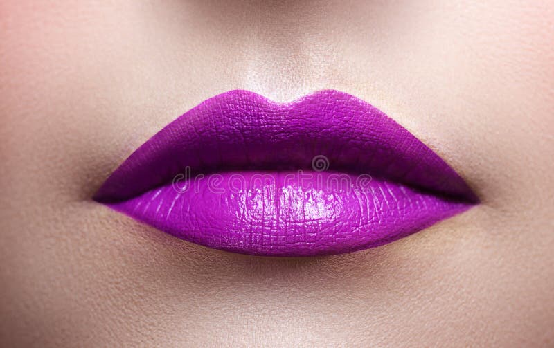 Female Lips Closeup. a Girl Holding a Flower in Her Lips Stock Photo