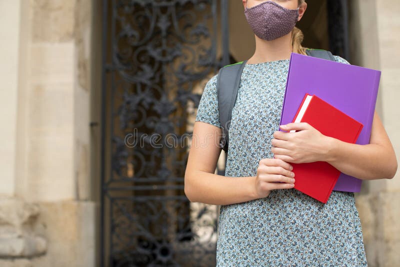 Close Up Of Female Student Standing Outside College Or University Building Wearing Face Mask During Covid-19 Pandemic royalty free stock photography Close Up Of Female Student Standing Outside College Or University Building Wearing Face Mask During Covid-19 Pandemic royalty free stock photography