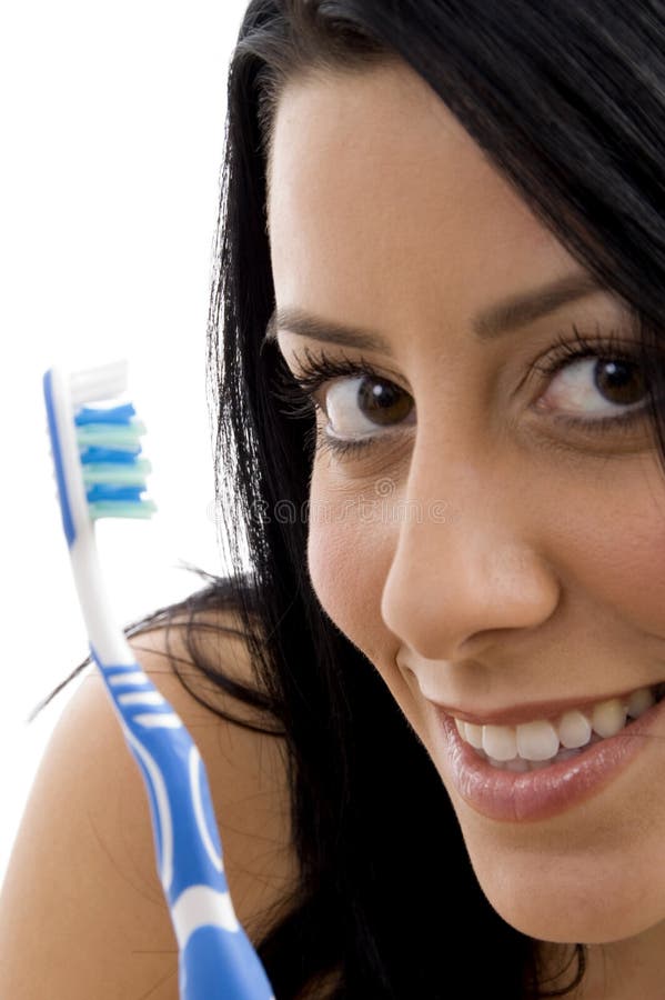 Close up of female with toothbrush