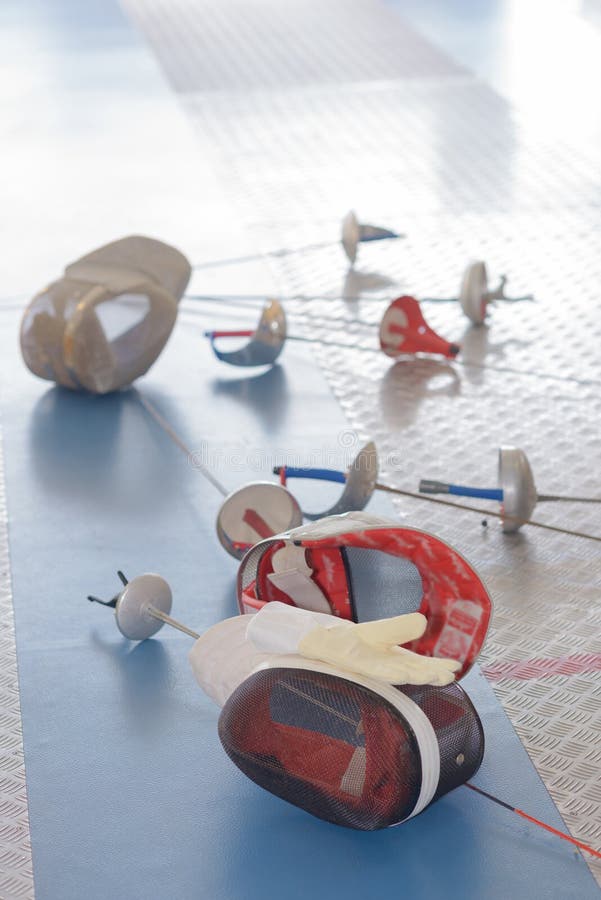 Fencing Equipment Concept, Crossed Swords and Protective Helmet with