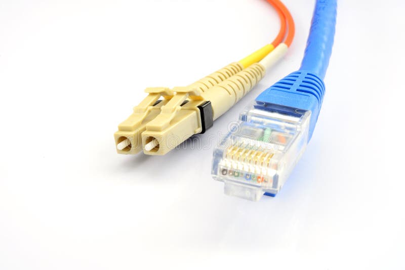 Close Up Of A Fiber Optic Patchcord Head And UTP LAN Cable Head Stock