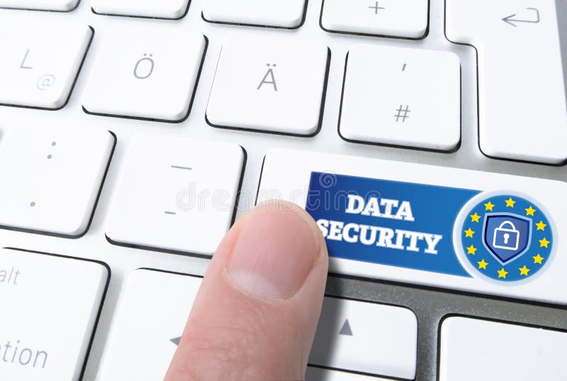 Finger pressing key labeled DATA SECURITY with padlock on computer keyboard stock photography