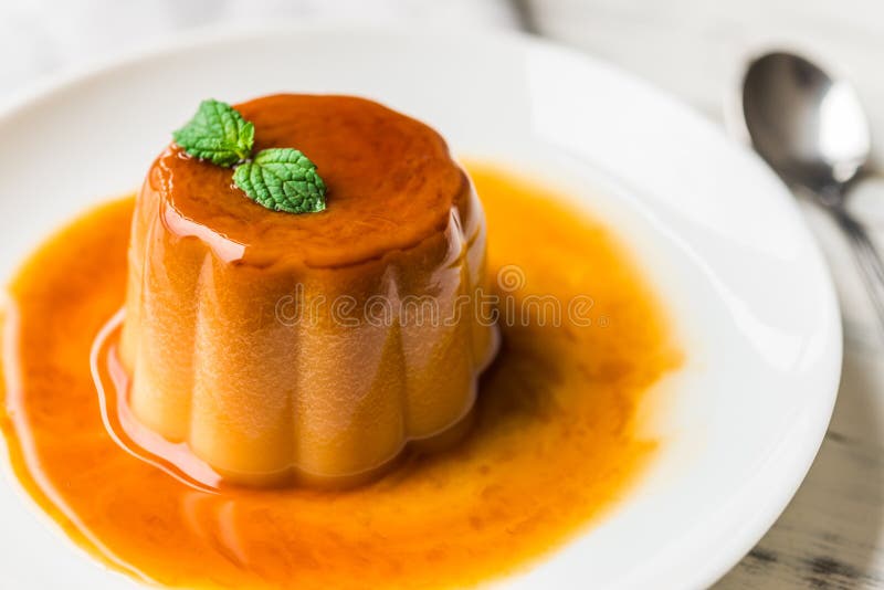 Close Up of a Flan Creme Caramel Pudding with Mint, a Custard Dessert. Stock Image Image of