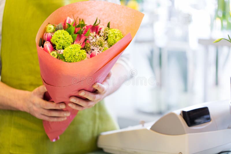 Close up of florist with bunch at flower shop