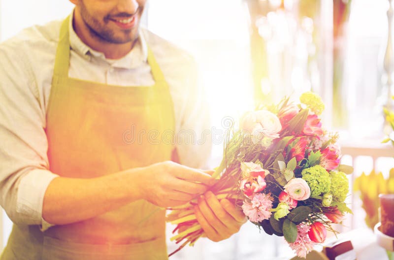 Close up of florist man with bunch at flower shop