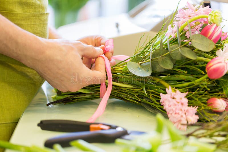 Close up of florist man with bunch at flower shop