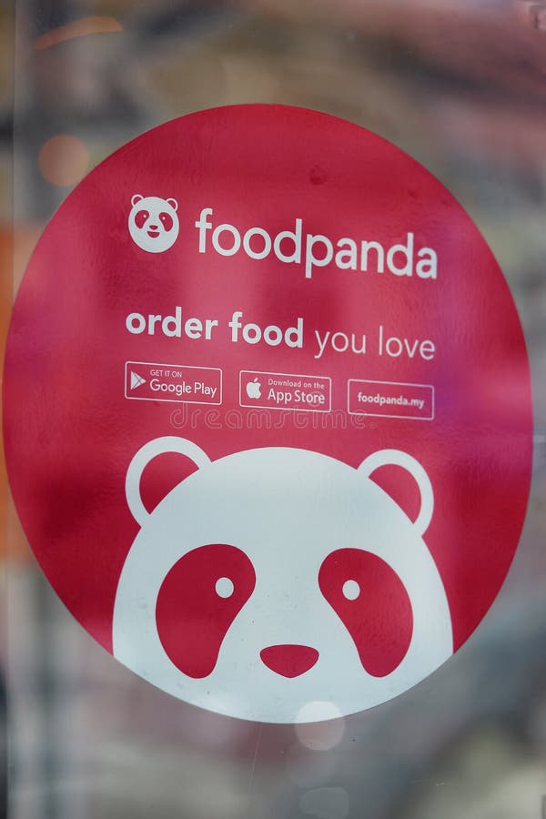 Sticker promoting Foodpanda at the glass window of a restaurant in Ipoh, Malaysia - close-up. Sticker promoting Foodpanda at the glass window of a restaurant in Ipoh, Malaysia - close-up