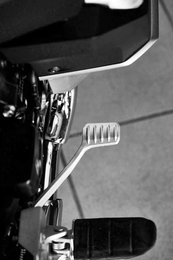 Close Up of Foot Pedal and Brake Pedal of Motorcycle Stock Photo