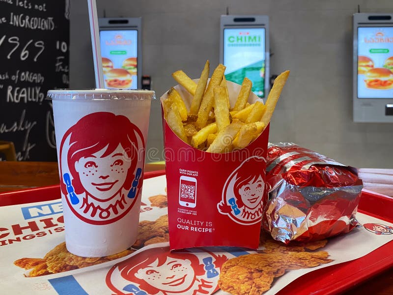 Close-up of french fries, drink and Burger on a tray at Wendys fast food restaurant