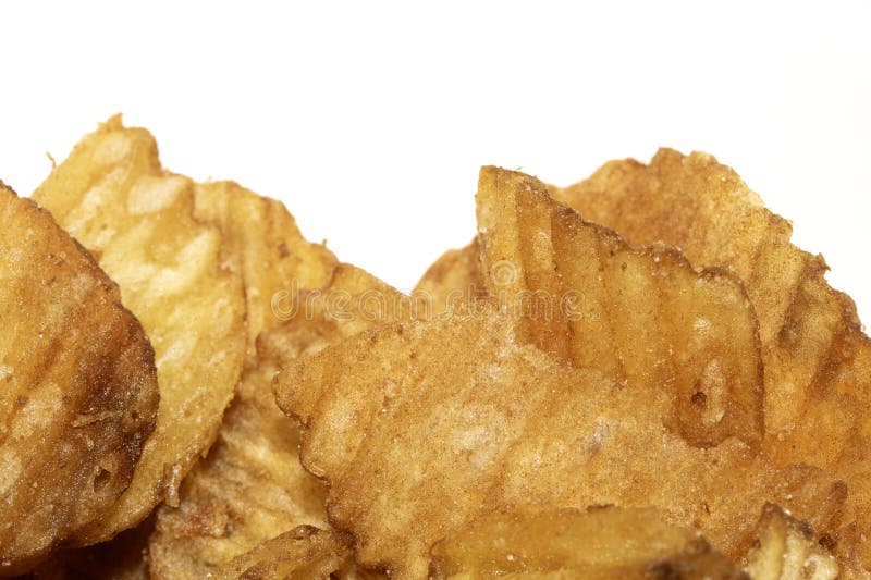 Close up of fresh crinkle cut seasoned crisps snack stock photography