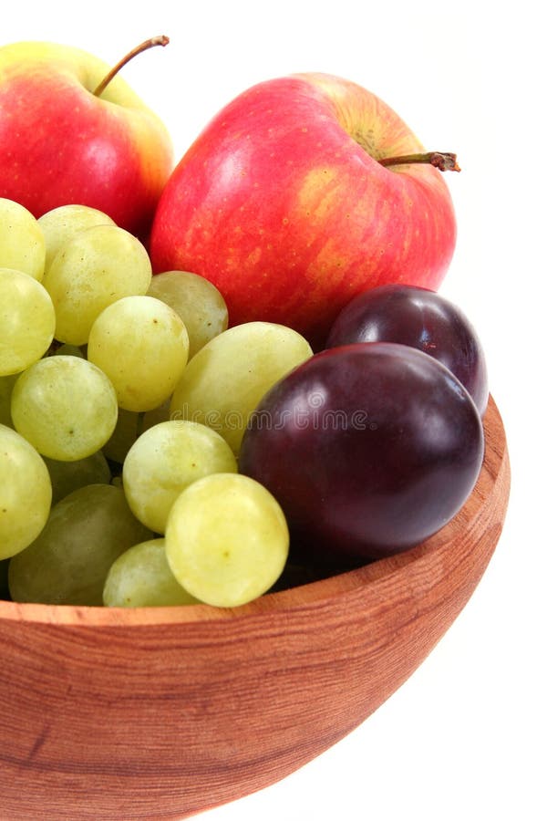 Close up of fresh fruit in wooden bowl