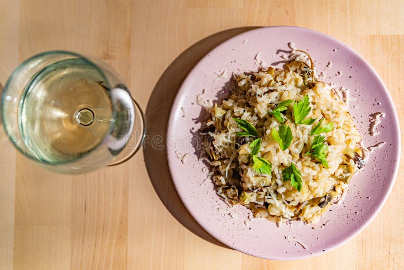 Artichoke risotto is a traditional staple of italian cuisine, prepared with organic ingredients. Artichoke risotto is a traditional staple of italian cuisine, prepared with organic ingredients