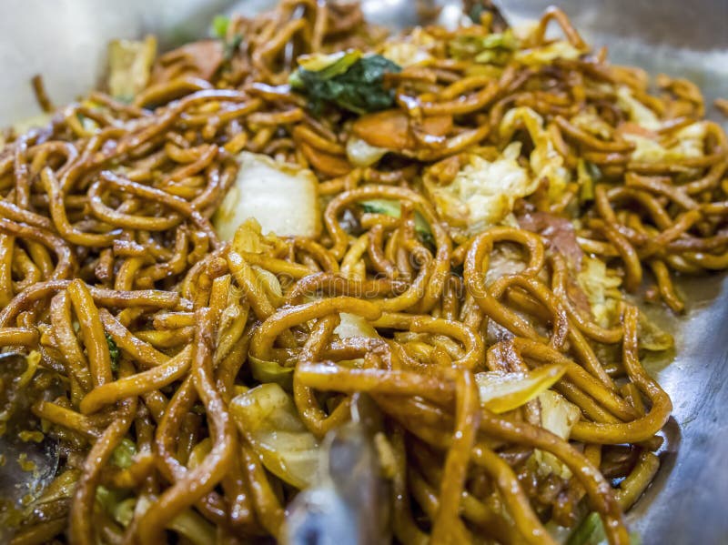 Close-up of Fried Chinese Egg Noodles in Soy Sauce Stock Photo - Image