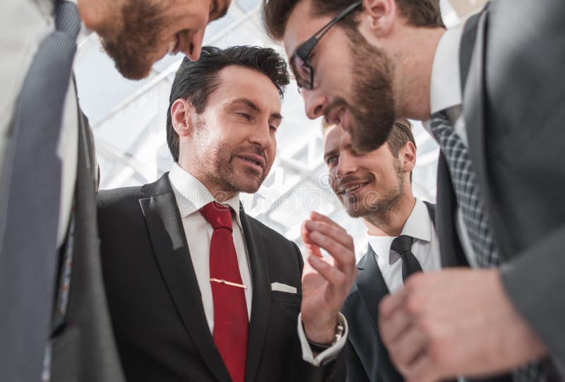 Close up.a friendly business team discusses the news royalty free stock photography Close up.a friendly business team discusses the news royalty free stock photography