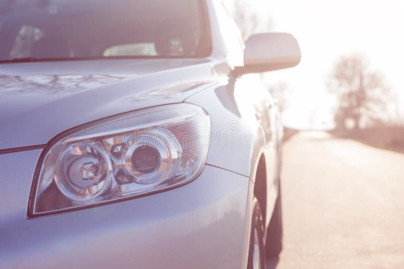Close up front new silver SUV car. Detail of a modern car. Head light royalty free stock photo Close up front new silver SUV car. Detail of a modern car. Head light royalty free stock photo