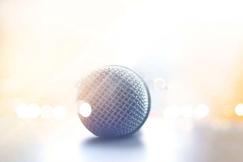 Close up front view of microphone in concert hall on floor stage royalty free stock photo