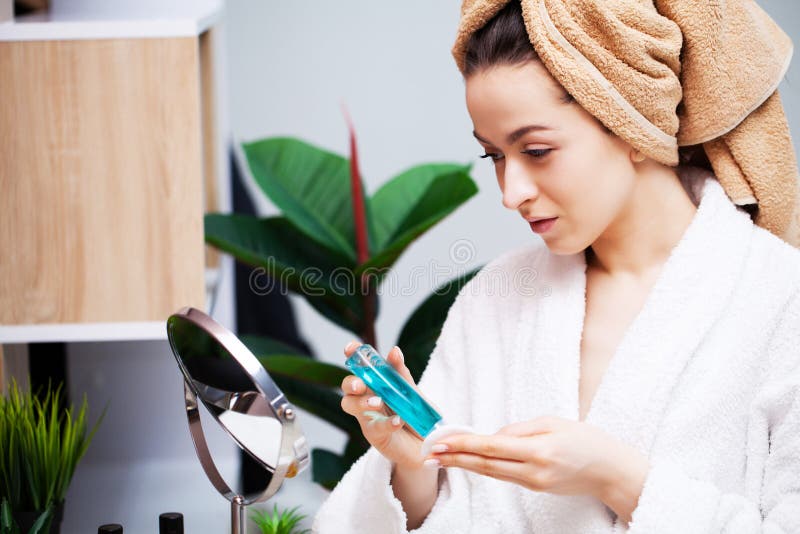 Close Up Girl Puts Lotion For Face Care On Hand Stock Image Image Of 