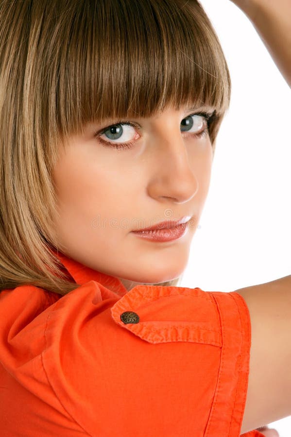 Close up of glamor girl in a orange dress isolated