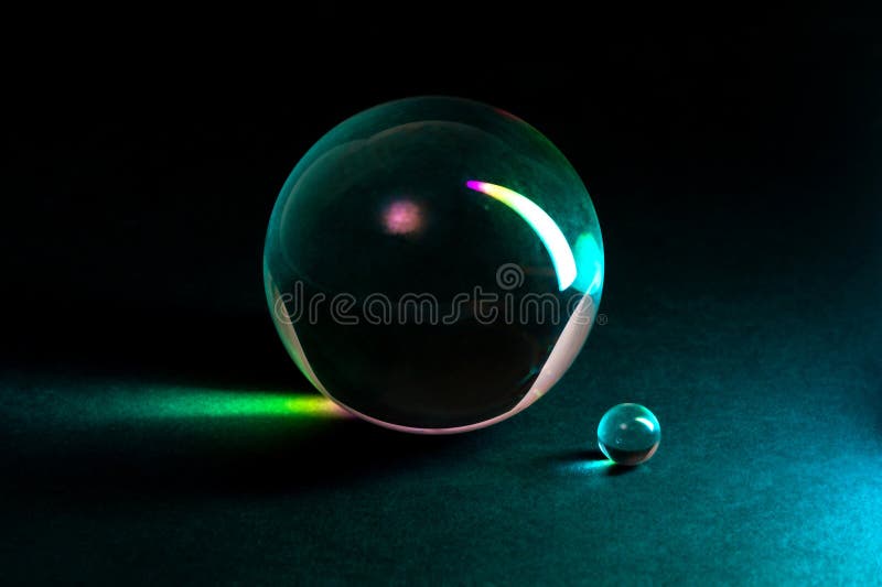 Close-Up of Glass Spheres in Vibrant Colorful Lighting stock images