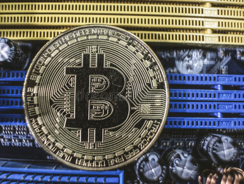 Close-up of gold bit coin, computer circuit board with bitcoin processor and microchips. Electronic currency, internet finance. royalty free stock photos Close-up of gold bit coin, computer circuit board with bitcoin processor and microchips. Electronic currency, internet finance. royalty free stock photos