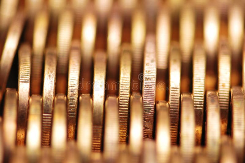 Close up of gold coins in rows stock photography Close up of gold coins in rows stock photography