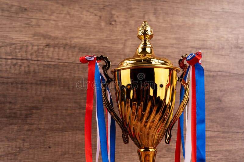 Golden trophy with ribbon stock images