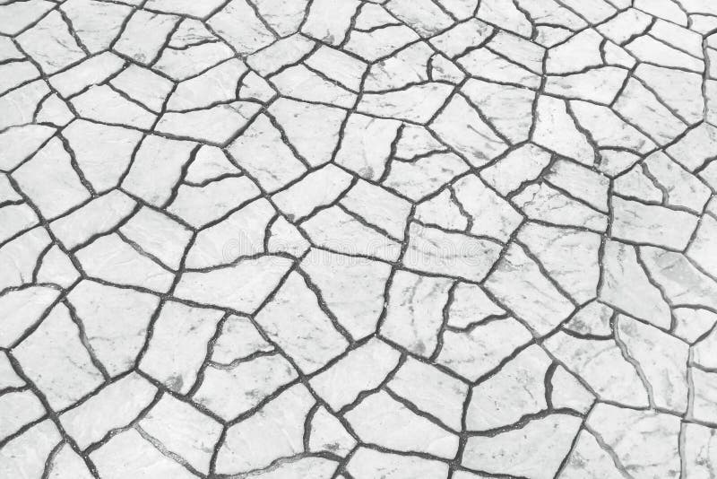 Close up gray pavement stone texture with cracked patterns decorative on background