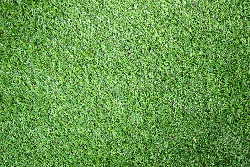 Close up Green artificial grass textures background stock photo