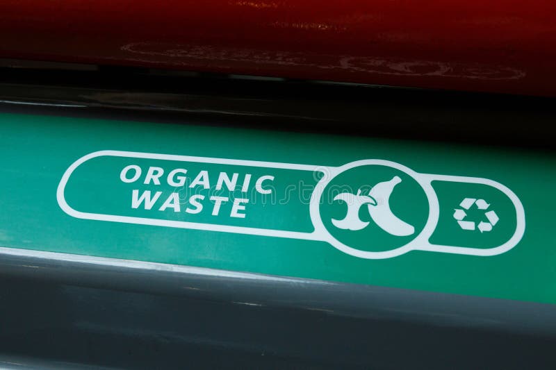 Close-up of green organic waste recycling bin lid royalty free stock photo