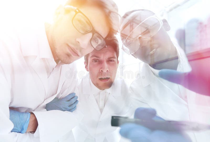 Close up.a group of scientists discussing the results of the exp royalty free stock photos Close up.a group of scientists discussing the results of the exp royalty free stock photos