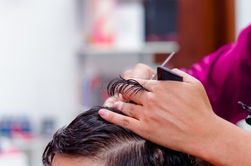 Close Up of Hair Cutting, Comb and Scissors are Used in this Process