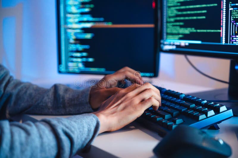 Close up hand of Asian prompt engineer develop coding app with software data sitting in front of computer monitor at office stock images