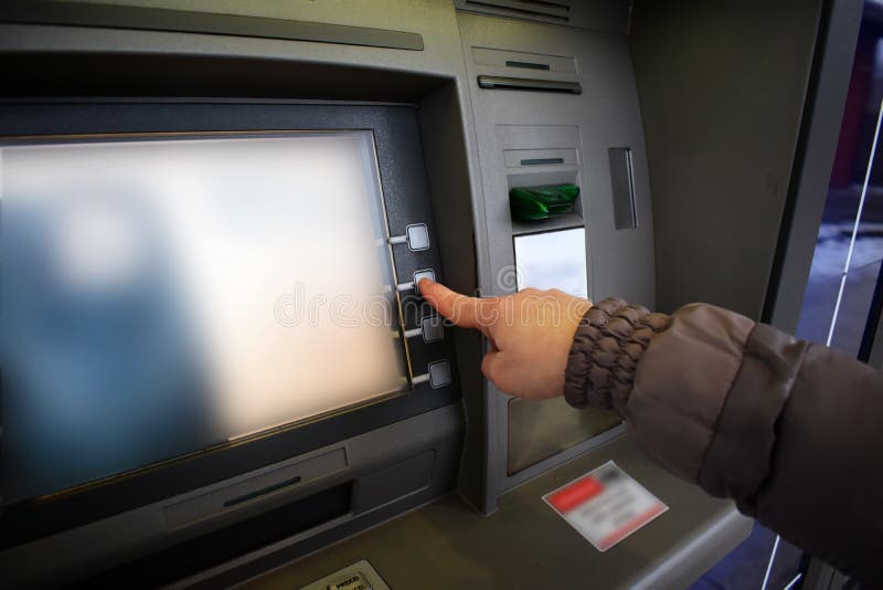 Close up of hand entering pin at an ATM. Woman using banking machine royalty free stock images Close up of hand entering pin at an ATM. Woman using banking machine royalty free stock images