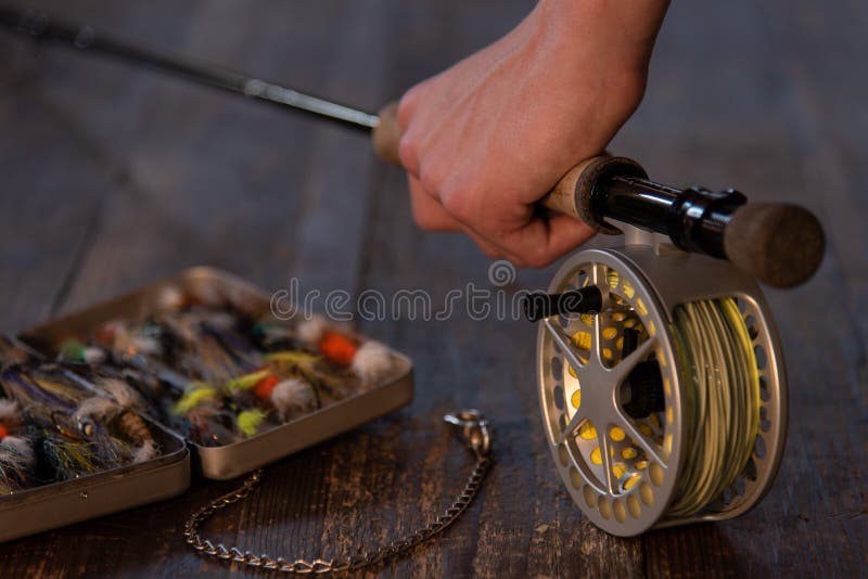 Close Up of Hand with Fly Rod and Fly Box Stock Photo Image of