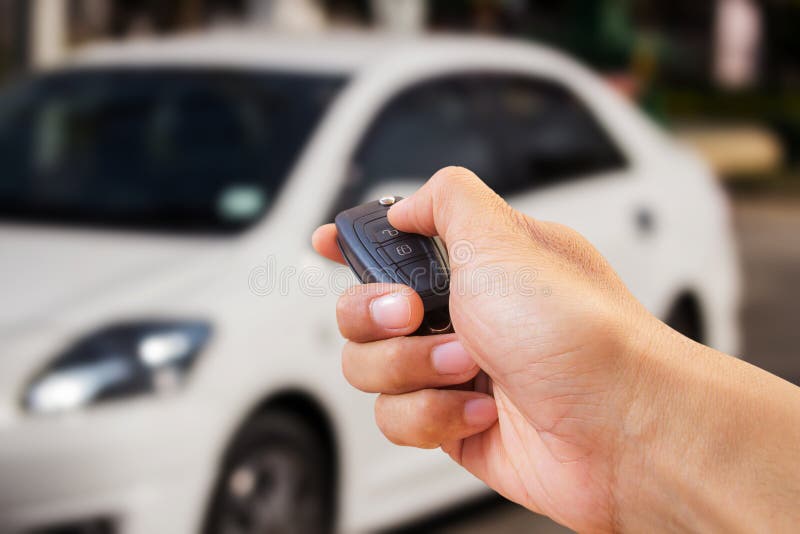 Close up hand holding car key