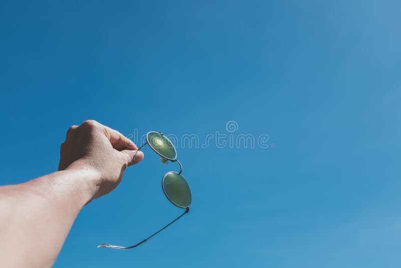 Close Up Hand of a Man Holding Sunglasses Stock Photo Image of travel