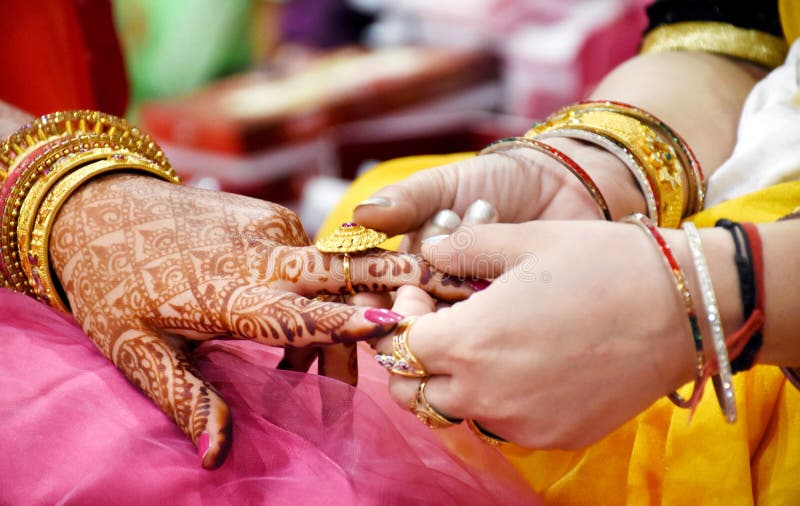 Close Up on Hand of a Man Put on an Engagement Ring on the Finger of