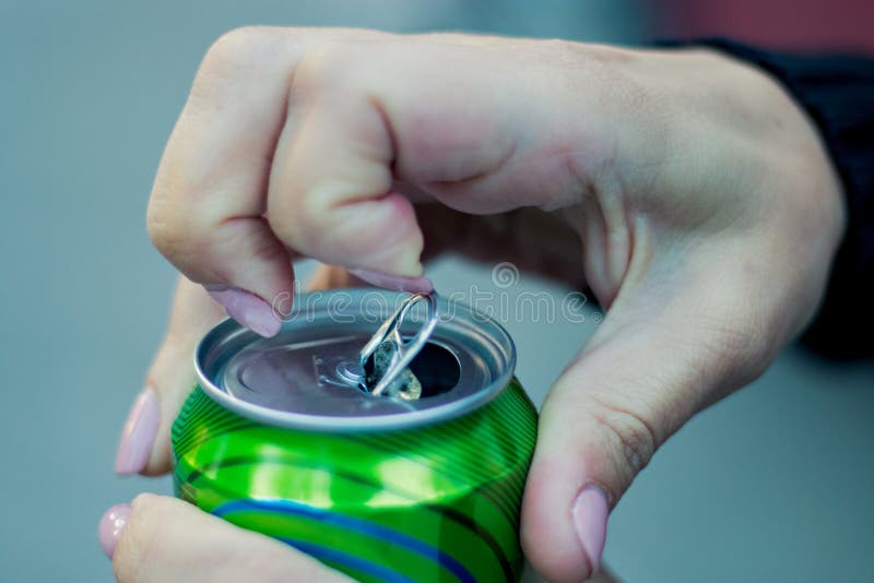 Close up of a hand opening a beverage stock image Close up of a hand opening a beverage stock image