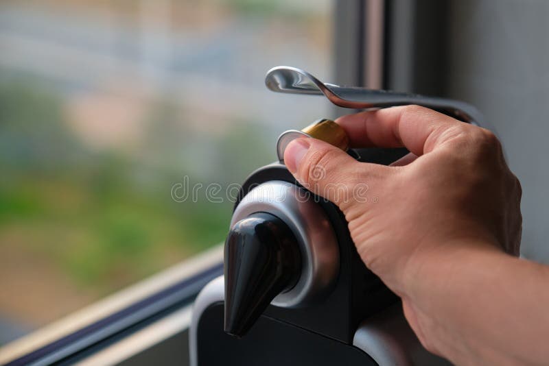 Close up of a hand preparing coffee in a coffee machine with capsules. stock image