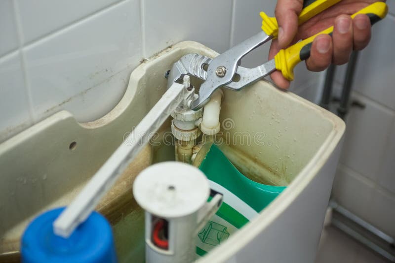 Close Up of Hand Repairing Toilet Stock Image Image of repairman