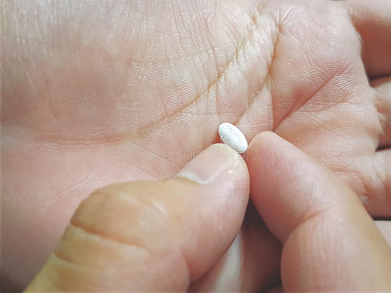 Taking a Medication Pill from a Hand stock photos Taking a Medication Pill from a Hand stock photos