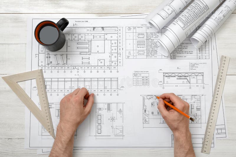 Closeup Hands of Architect Working with Pencil on a Drawing Stock