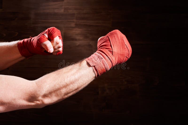 Close-up of Hands of Boxer with Bandage Ready for a Fight Against